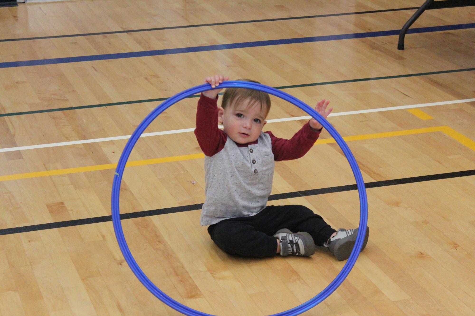 Toddler hoola hoop in gym