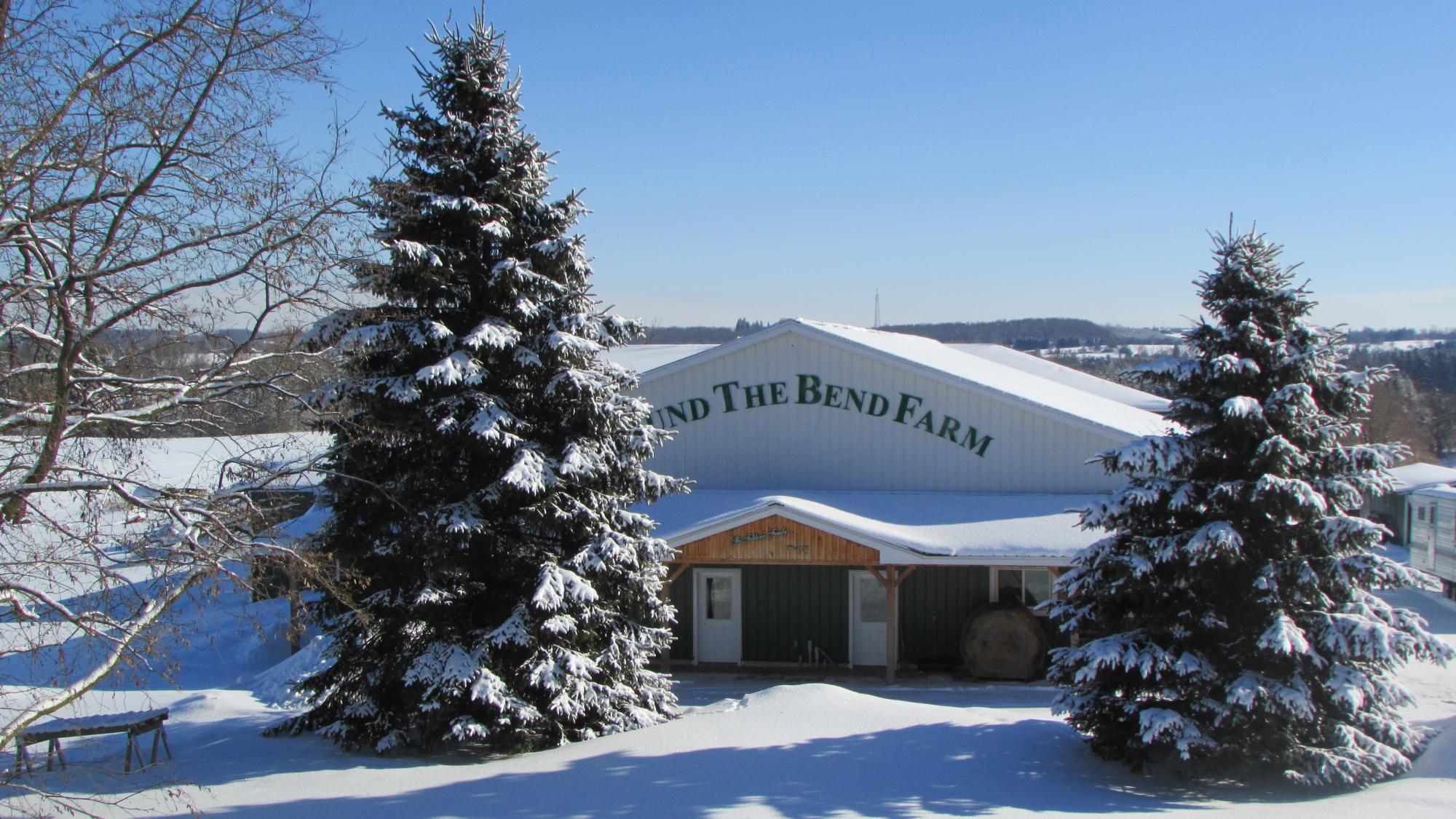 Round the bend farm exterior in the snow