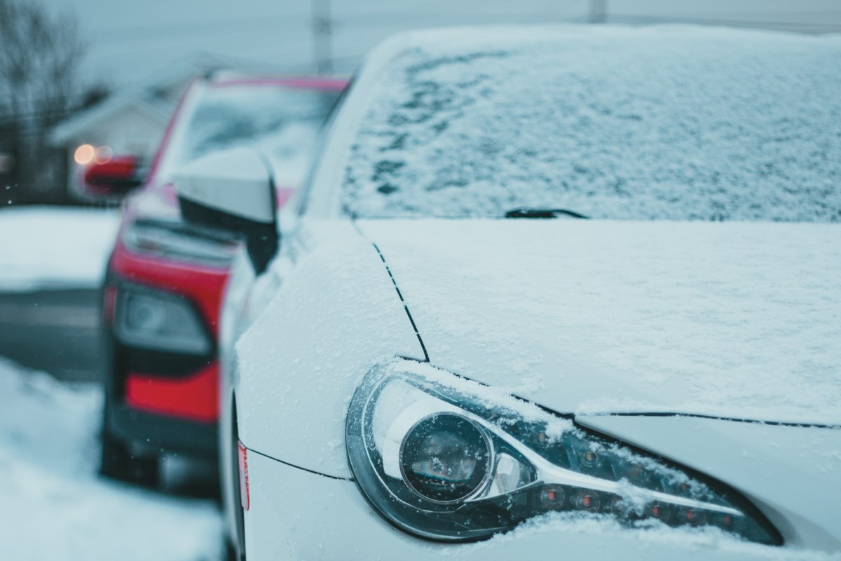 Cars parked on snowy street