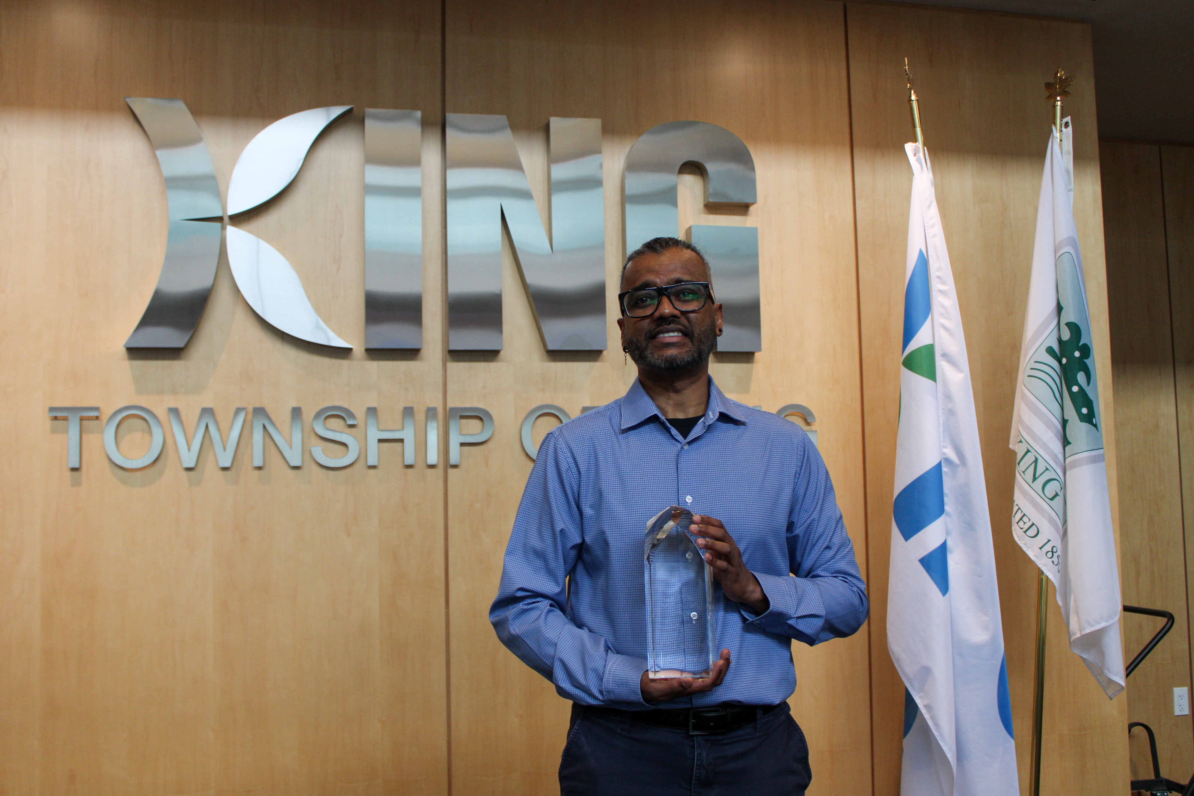 Barry Budhu, Manager of Transportation, Utilities & Fleet Services holding King Township's Geotab Innovation Award for Productivity (Small–Medium)