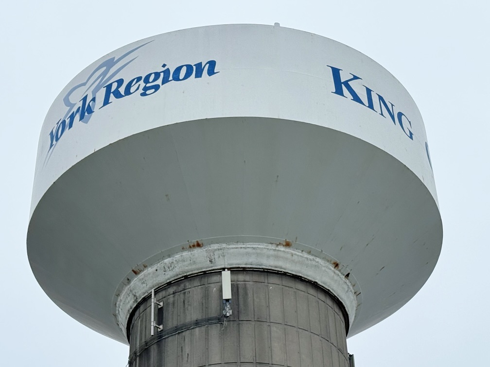 Image of white and blue water tower with King Township logo and York Region logo