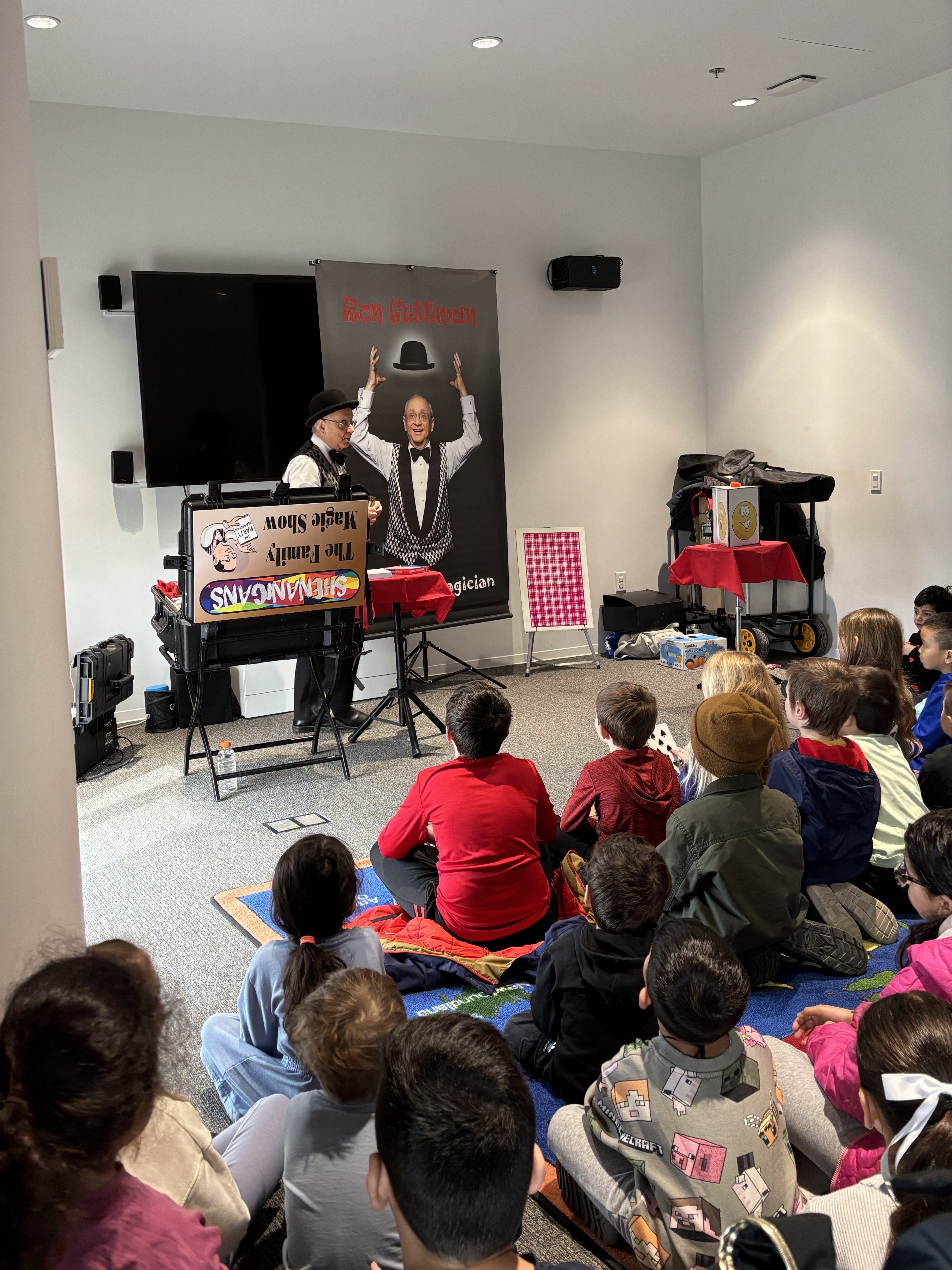 Magician performing tricks in front of an audience