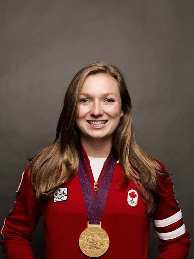 Image of Rosie MacLennan smiling wearing Team Canada attire and an Olympic gold medal