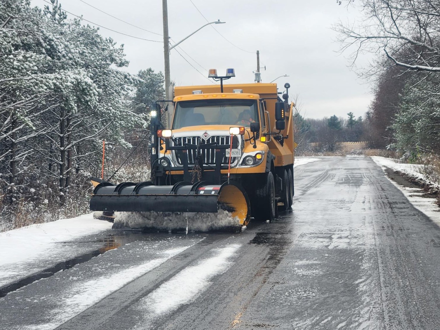 Staff conducting snow removal efforts