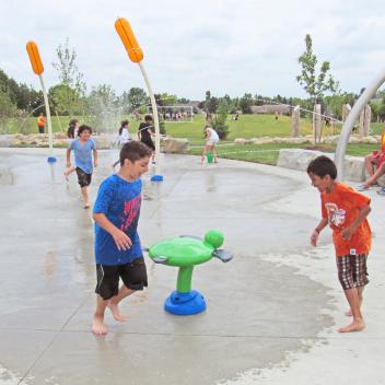 Kids playing in Tasca Park splash pad