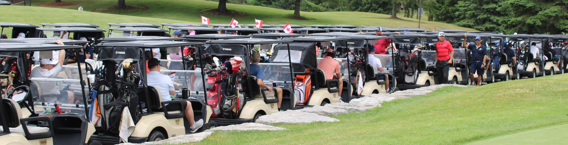 Golfs cart lined up at the Mayor's Annual Golf Tournament