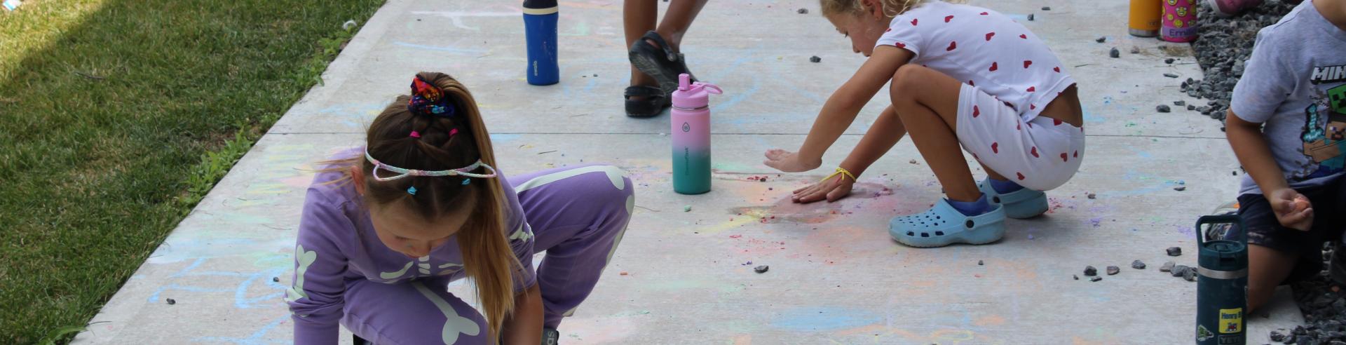 Children drawing with chalk