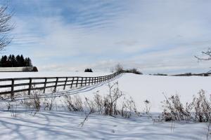Rolling snow covered farm fields