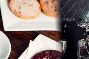 banner image left side shows person's hand holding a coffee mug with cookies on a side plate, right side shows barista making a coffee beverage