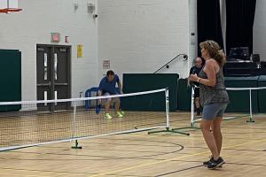 Adults playing pickleball