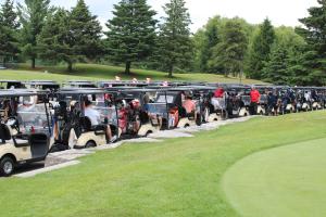Golfs cart lined up at the Mayor's Annual Golf Tournament