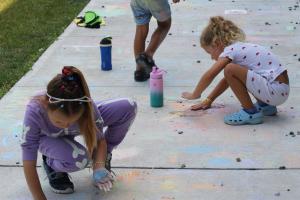 Children drawing with chalk