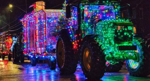Image of tractor covered in a lot of christmas lights for the Main Street Christmas event